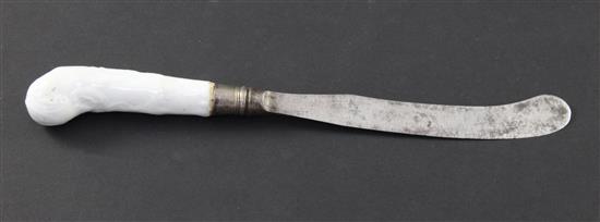 An early English porcelain white glazed moulded knife handle, 23cm